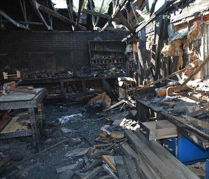 devastating fire damage toa workshop, charred elements